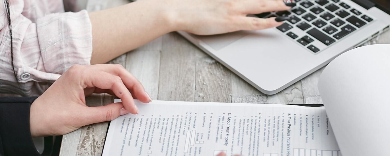 a person typing on laptop