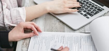 a person typing on laptop